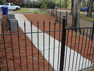 Concrete side walk, iron fence and stairs installations in Birmingham, Al