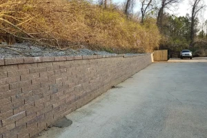 03_retaining_wall_behind_expressoilchange.webp